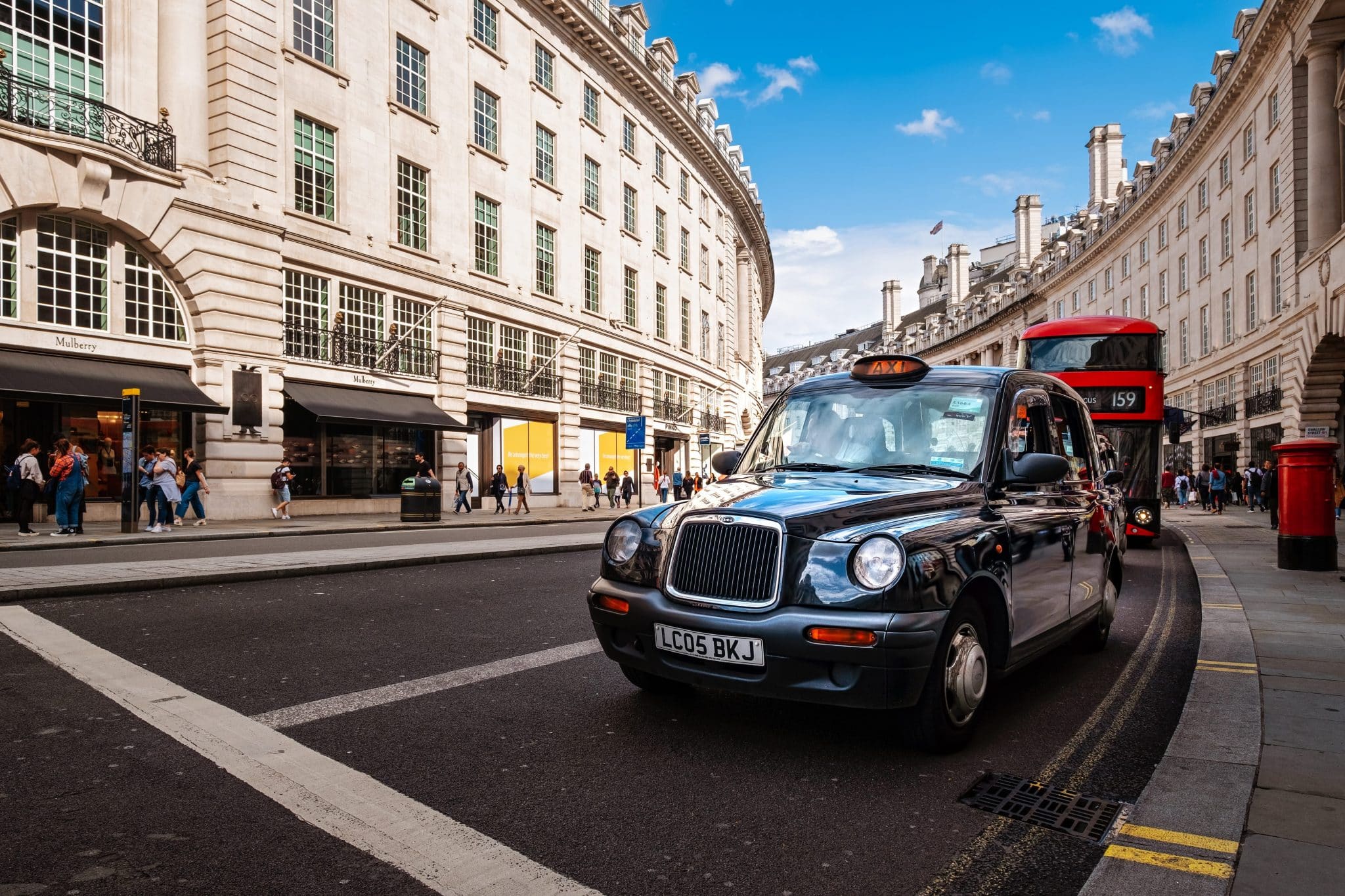 a black cab and a bus on regent street