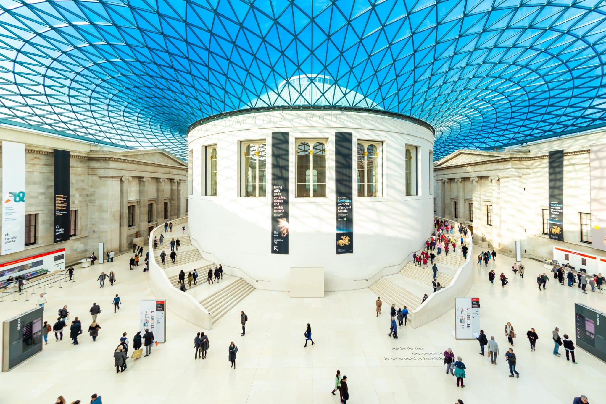 a wide shot of the main foyer of The British Museum, with people milling around